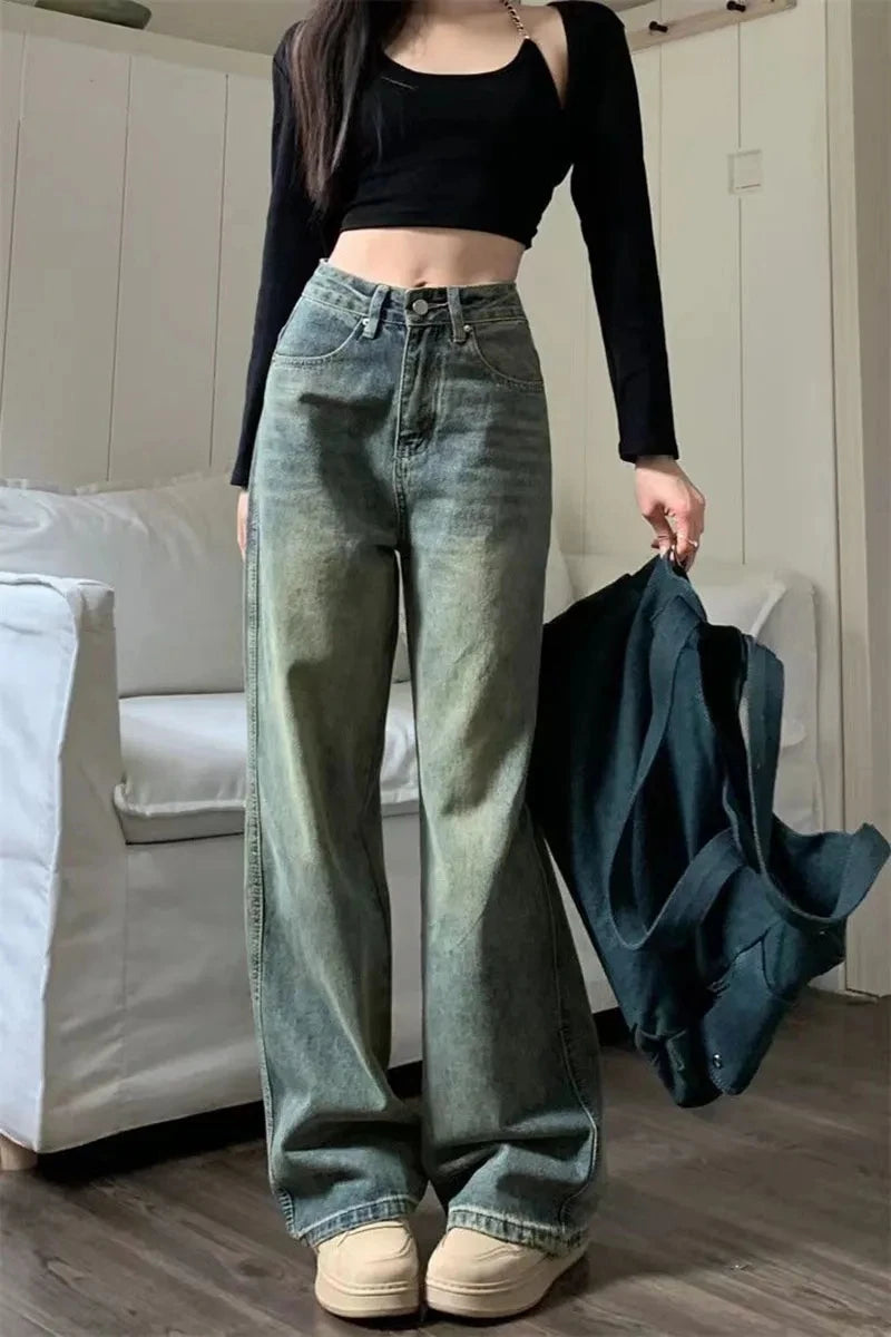 Y2K baggy jeans women in a relaxed fit, paired with a cropped black top and sneakers, stylish casual look