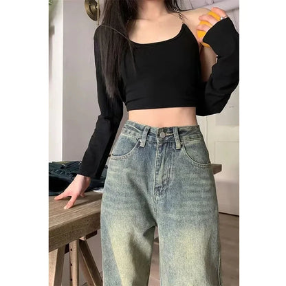 Trendy model wearing y2k baggy jeans women paired with a stylish black crop top