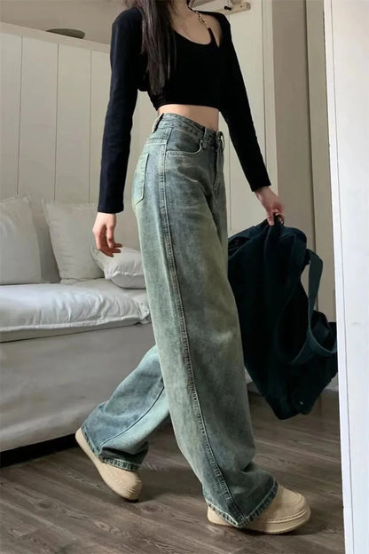 Stylish y2k baggy jeans women in faded green, paired with a black crop top for a trendy look