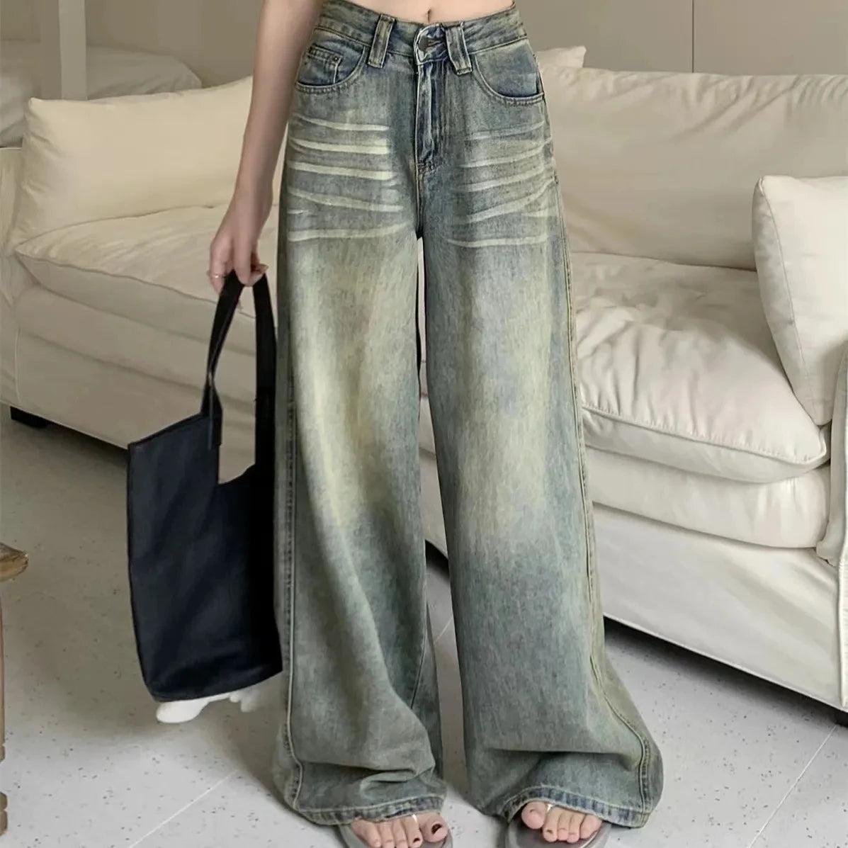 Fashionable Y2K baggy jeans women with a wide-leg fit and distressed detailing for a trendy look