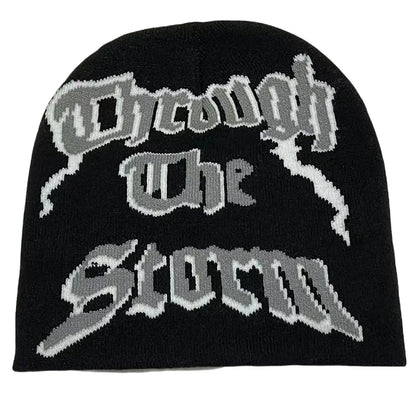 Black Y2K beanie for women and men with intricate 'Through The Storm' design in grey