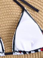 LuckeLadybug Y2K swimwear bikini top in white with stylish trim and adjustable straps
