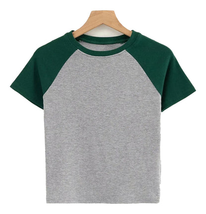 Stylish LuckeLadybug LLC 90s vintage crop top with gray body and green sleeves